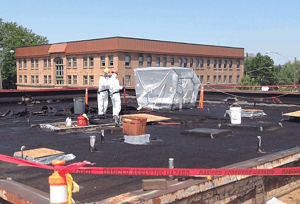 Asbestos abatement from a commercial building roof