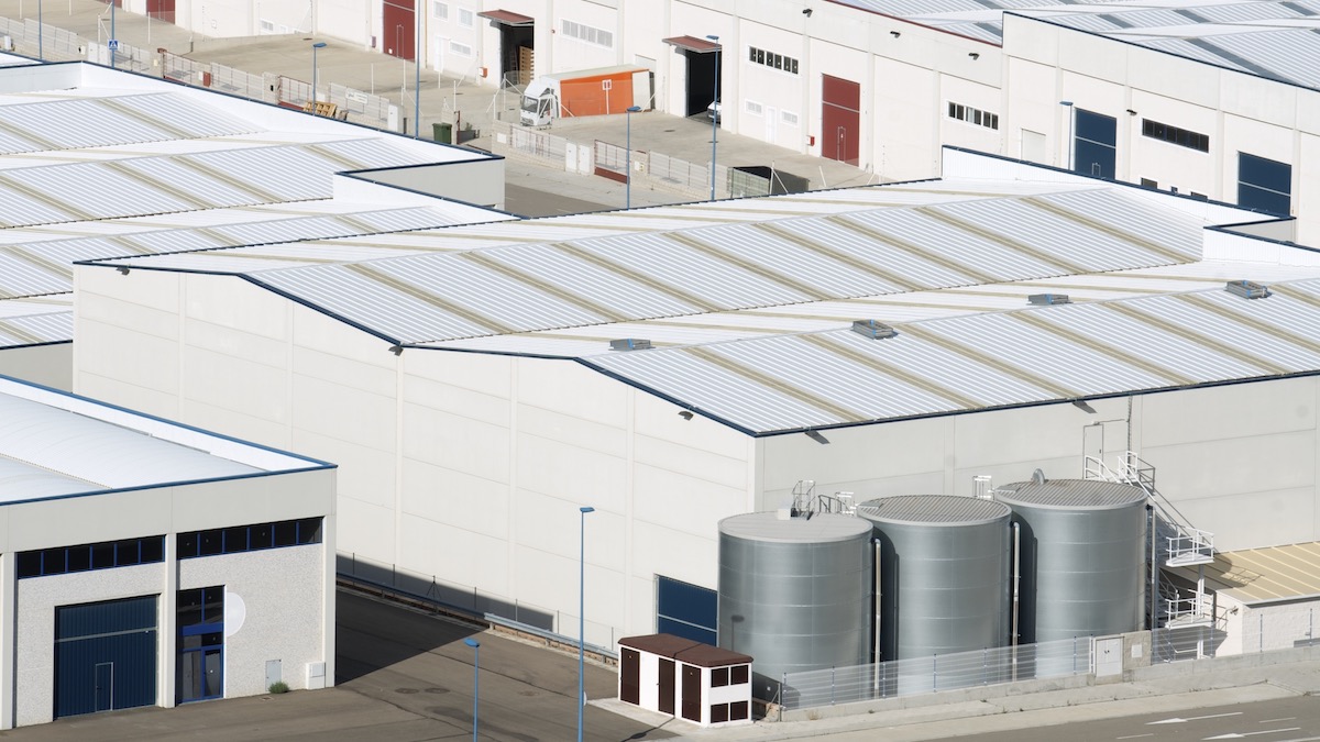 Quality commercial roofing systems atop warehouse and industrial spaces