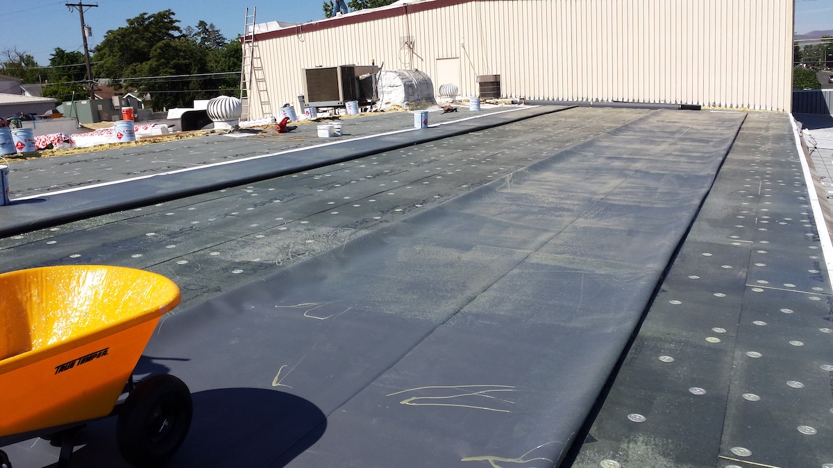 Commercial metal roof retrofit with underlay, insulation and TPO in Clarkston, WA