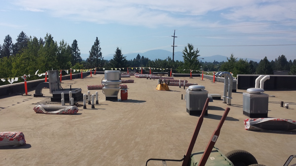 ITD Ballasted commercial flat roof deck with river rock ballast removed