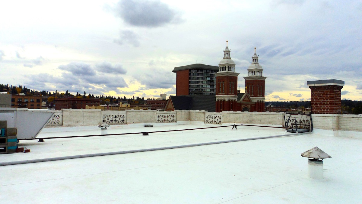 Historic Spokane Club flat roof covered with TPO single-ply membrane roofing