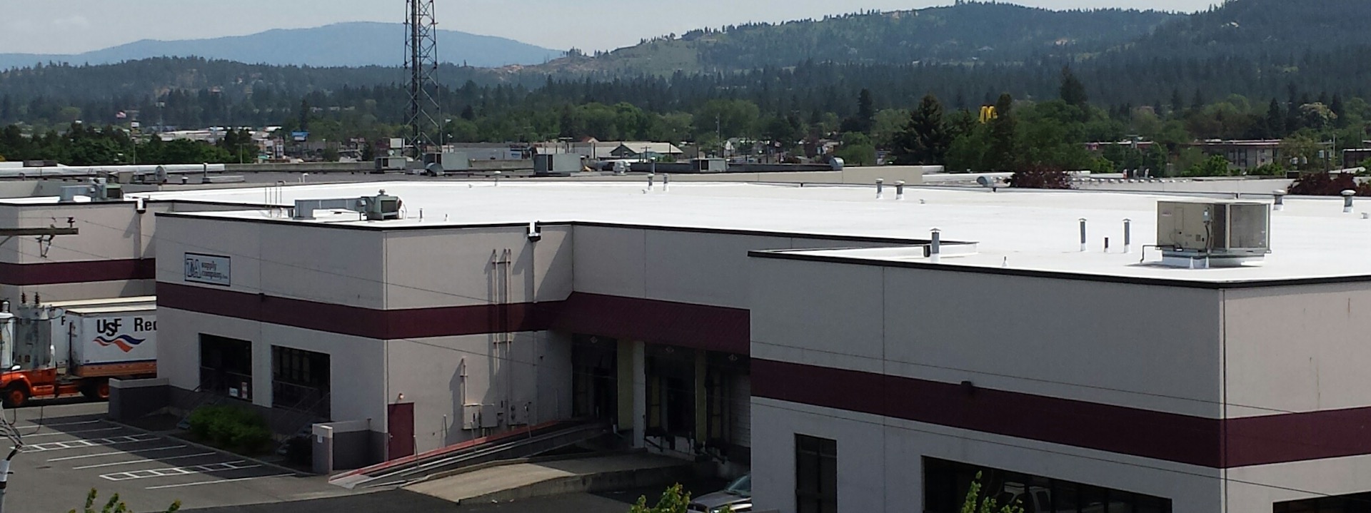 44,000 square foot industrial flat roof covered in TPO over EPDM