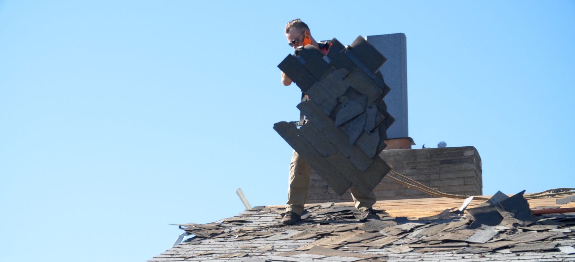 Residential roof wind damage replacement of asphalt shingles