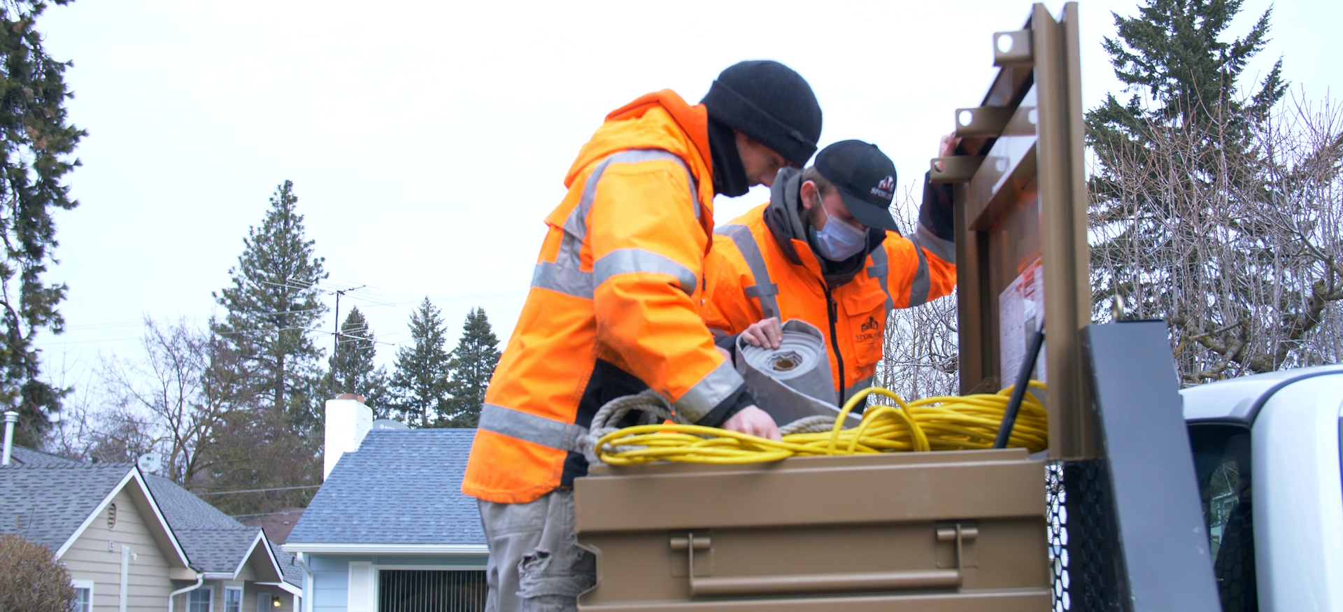 Spokane Roofing Company Construction Crew Searches A Tool Box Chest During The Pandemic